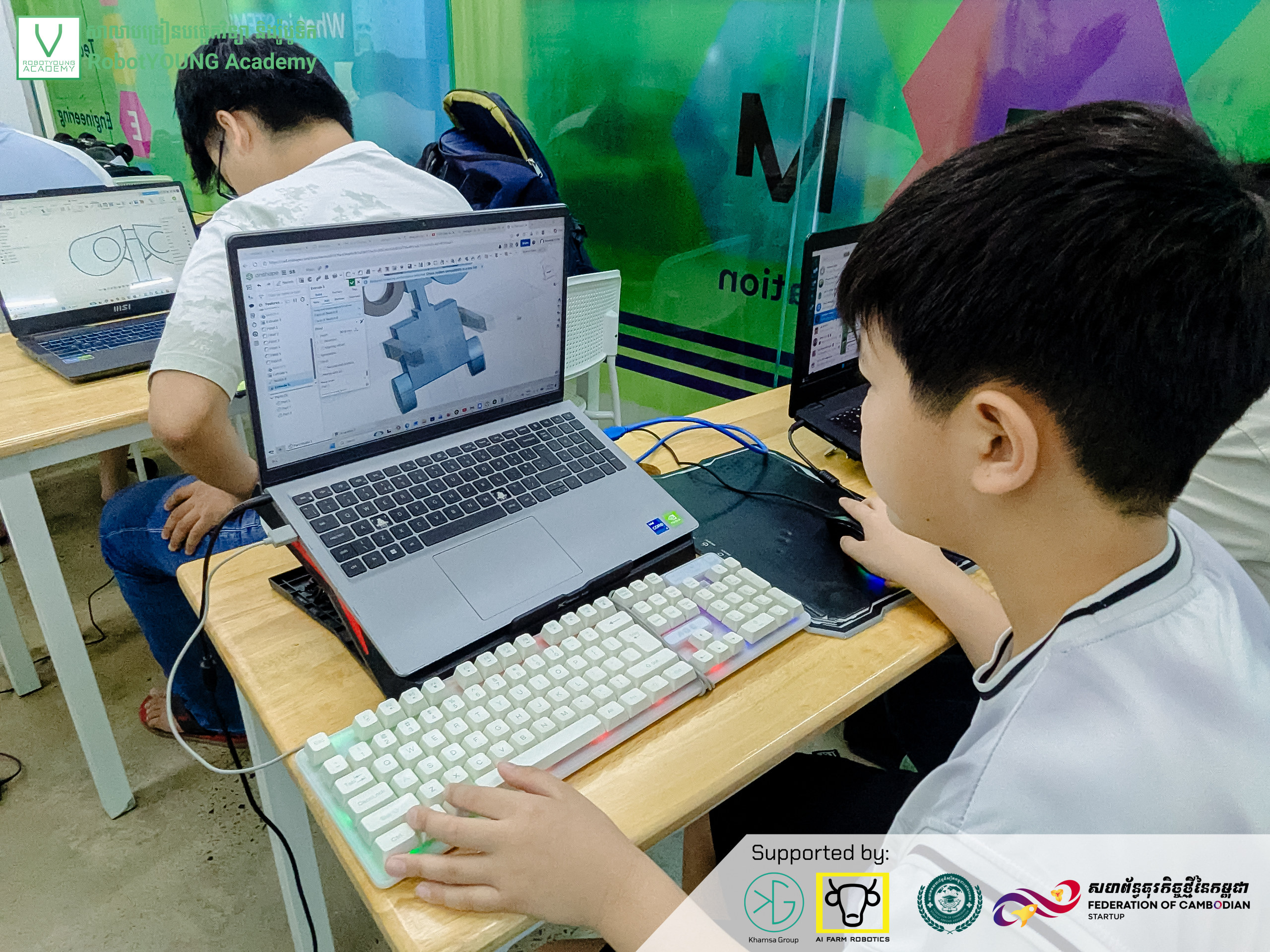 A student exploring a three-dimensional model on a laptop