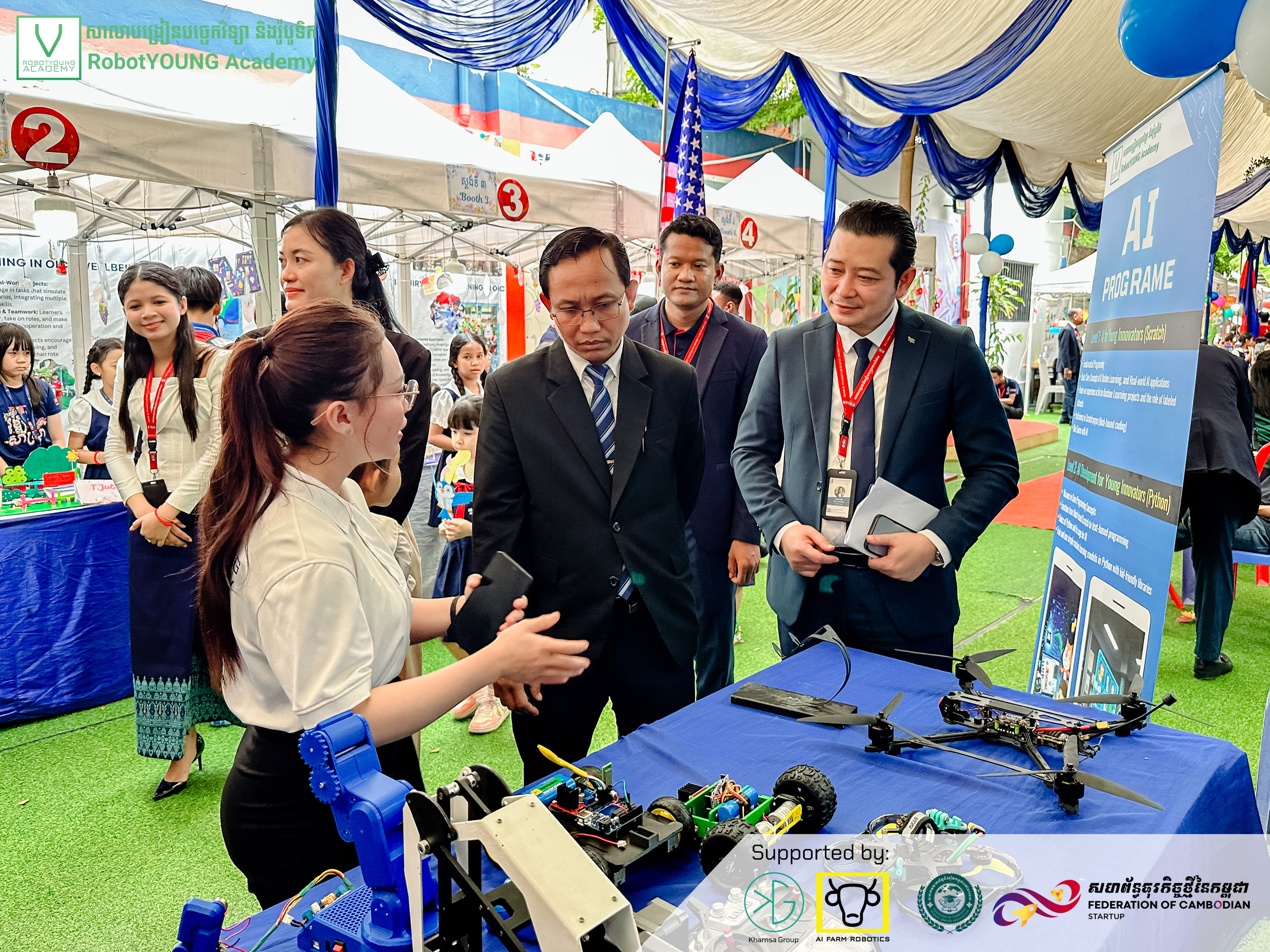 An exhibitor sharing robot models with visitors
